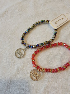 MK stretch braclets with bling charm